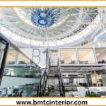 Modern commercial interior design in Muscat creating a premium brand look with elegant furniture and lighting.
