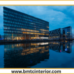 Here are a few options for ALT text, ranging in descriptiveness, for your image: **Option 1 (Concise & Direct):** > Commercial interior design in Oman, showcasing a smart and modern office space. **Option 2 (Slightly More Descriptive):** > A well-lit, contemporary commercial interior design in Oman, featuring smart technology and comfortable workspace elements. **Option 3 (Focus on "Smart Spaces"):** > Modern commercial interior design in Oman, demonstrating a smart office layout with integrated technology and efficient use of space. **Option 4 (More Evocative):** > Inspiring commercial interior design in Oman, presenting a sophisticated and technologically advanced workspace designed for business success. **Option 5 (If the image shows specific elements):** > A sleek commercial interior design in Oman with open-plan seating, integrated smart displays, and natural light, ideal for modern businesses. **Key considerations for choosing the best ALT text:** * **What does the image *actually* show?** If it's a wide shot of a whole office, a general description works best. If it highlights a specific feature (like a smart screen or a particular furniture arrangement), you might want to mention that. * **What's the most important message of the image for the post?** Is it about the modernity, the technology, the comfort, or the overall professional feel? * **Keep it concise:** While descriptive, avoid overly long or keyword-stuffed ALT text. **I recommend Option 2 or 3 as they strike a good balance between being descriptive and directly relevant to the post's title.**