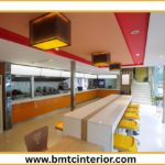 Interior design of a modern fast food restaurant in Muscat showcasing a smart layout for efficient customer flow and quick service.