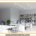 Here are several options for descriptive ALT text, ranging in detail. Choose the one that best suits the specific visual content of the image and the overall context of your blog post. **General & Concise Options:** * **Option 1 (Focus on location and purpose):** Modern office interior design in Muscat, Oman, promoting productivity. * **Option 2 (Slightly more descriptive):** A bright and functional modern office space in Muscat, designed for a productive workplace. * **Option 3 (Emphasizing key elements):** Productive modern office interior in Muscat featuring natural light and ergonomic furniture. **More Detailed Options (if the image shows specific features):** * **Option 4 (Highlighting specific elements like open plan, materials):** Open-plan modern office interior in Muscat with clean lines, natural wood accents, and ample natural light, designed for employee productivity. * **Option 5 (Focusing on a particular area or vibe):** A contemporary workspace in Muscat showcasing a collaboration area with comfortable seating and modern decor, fostering a productive atmosphere. * **Option 6 (If there are plants or specific colors):** A vibrant modern office interior in Muscat, featuring green plants, ergonomic workstations, and a color palette designed to enhance focus and productivity. **When choosing, consider:** * **What is the most prominent element in the image?** (e.g., desks, meeting area, view, lighting, decor) * **What message are you trying to convey with this specific image?** * **Is there anything unique or noteworthy about the design?** **Example Scenario:** If the image shows a bright, airy open-plan office with sleek desks, comfortable chairs, and a few potted plants, **Option 4** or **Option 6** would be excellent choices. If it's a more general shot of a well-lit office, **Option 1** or **Option 2** would suffice.