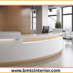 Here are several descriptive ALT text options for the image, catering to slightly different levels of detail and focus. Choose the one that best reflects the specific visual elements of the image and the overall message of your post. **Option 1 (Concise & Direct):** > Modern office reception interior design in Muscat, featuring a welcoming seating area and elegant desk. **Option 2 (Focus on First Impression):** > A sophisticated and inviting office reception area in Muscat, designed to create a strong, positive first impression with contemporary furnishings and subtle Omani influences. **Option 3 (More Detail on Elements):** > Sleek and professional office reception interior in Muscat, showcasing a stylish reception desk, comfortable waiting area with plush seating, and tasteful decorative elements. **Option 4 (Highlighting Atmosphere):** > The warm and welcoming ambiance of a modern office reception in Muscat, emphasizing thoughtful interior design for a memorable first impression. **Option 5 (If there are specific visual cues like color or materials):** > A contemporary office reception in Muscat, featuring [mention a prominent color, e.g., warm earth tones] and [mention a material, e.g., natural wood accents], creating an elegant and professional first impression. **Option 6 (Shorter, but still descriptive):** > Muscat office reception interior: modern, elegant, and designed for a great first impression. **Key considerations when choosing:** * **What is the most prominent feature of the image?** Is it the desk, the seating, the lighting, or the overall layout? * **What is the overall mood or feeling the image conveys?** Is it luxurious, minimalist, warm, professional? * **Are there any specific design elements that are unique or noteworthy?** (e.g., a specific type of lighting, artwork, or architectural feature). **Recommendation:** For this specific post title, **Option 2** or **Option 3** are likely the strongest choices as they directly address the "strong first impression" and provide a good level of detail about the reception area. **Example of how to use it in HTML:** ```html ```