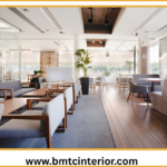 Interior of a stylish and compact cafe in Oman, showcasing smart space planning and design elements.