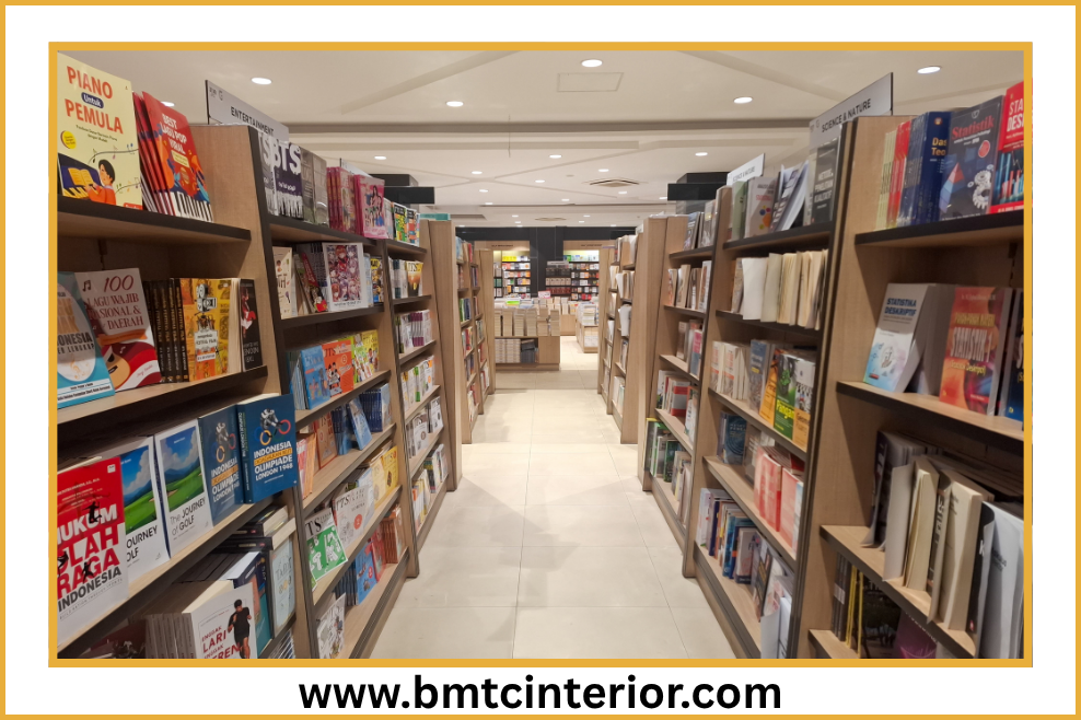 Bookstore interior in Oman with custom timber shelving, warm lighting and open browsing aisles